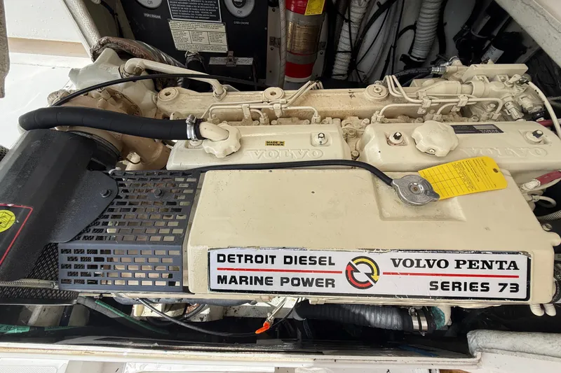 Slide: The Image of Engine compartment of a 1999 Blackfin 33 Flybridge with Detroit Diesel Volvo Penta Series 73. - 62