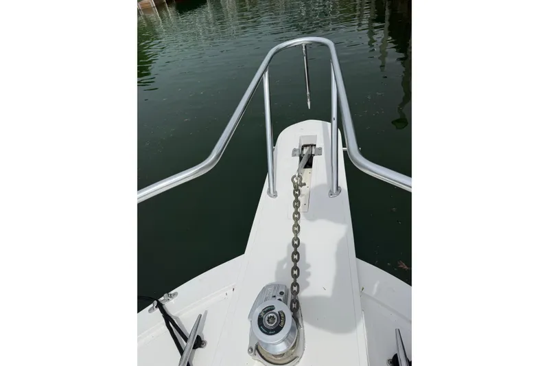 Slide: The Image of Bow view of 1999 Blackfin 33 Flybridge with anchor chain and railing. - 20