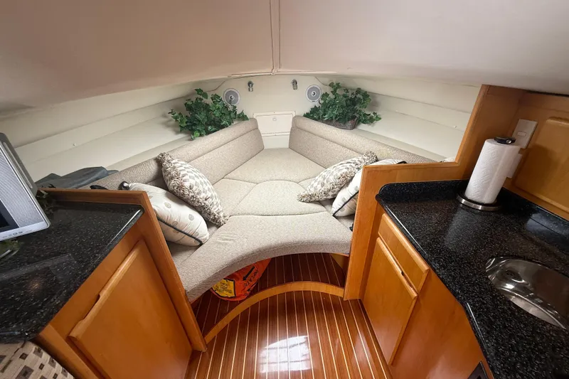 Slide: The Image of Luxurious interior of 1999 Blackfin 33 Flybridge with cozy seating and elegant wood finish. - 47