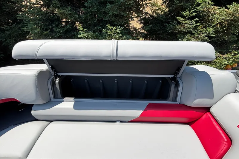 Slide: The Image of Open storage compartment on 2026 Sun Tracker Party Barge 22 XP3 boat seat. - 24