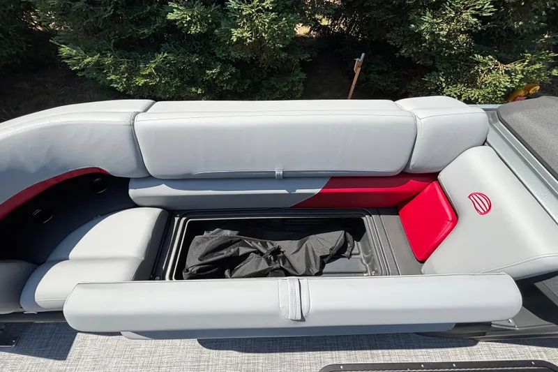 Slide: The Image of Sun Tracker Party Barge 22 XP3 2026 interior seating with storage compartment open. - 36