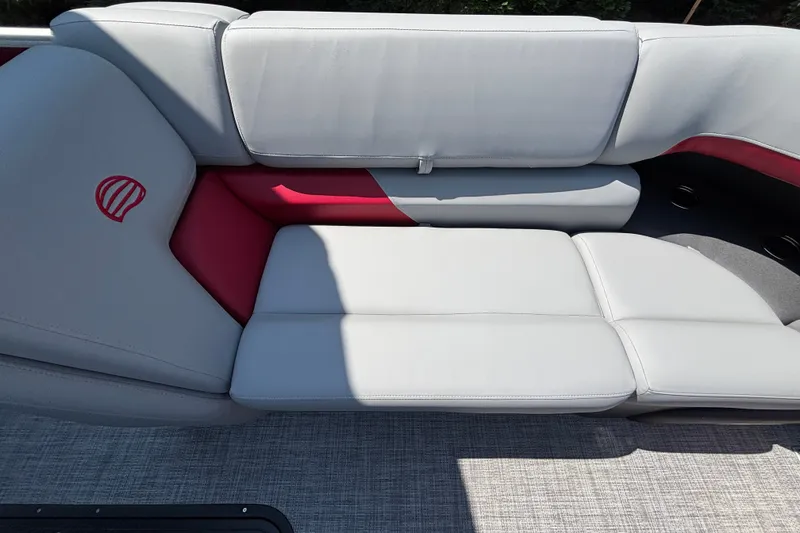 Slide: The Image of Sun Tracker Party Barge 22 XP3 2026, featuring luxurious gray and red seating. - 25