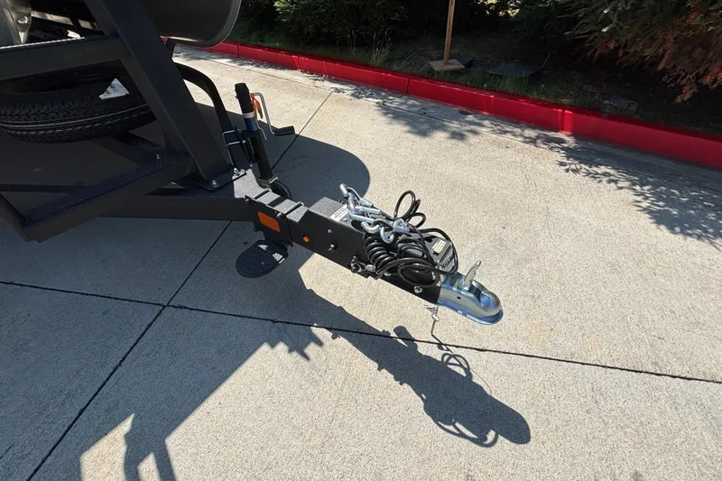 Slide: The Image of Trailer hitch of 2026 Sun Tracker Party Barge 22 XP3 on concrete surface. - 138