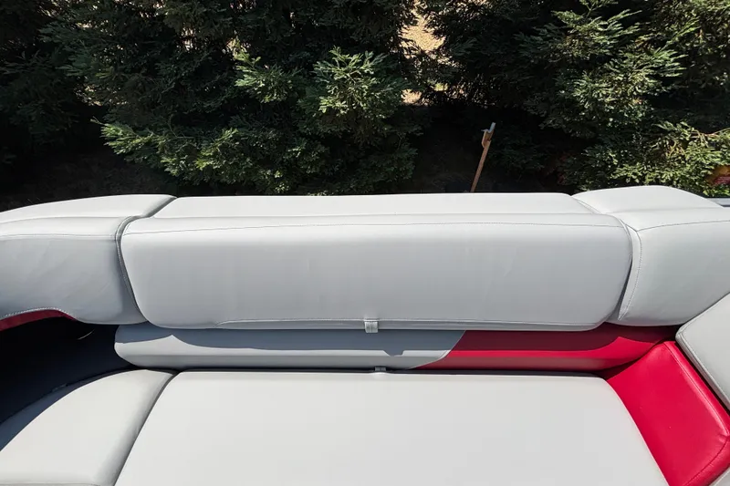 Slide: The Image of 2026 Sun Tracker Party Barge 22 XP3 seating with gray and red upholstery. - 27