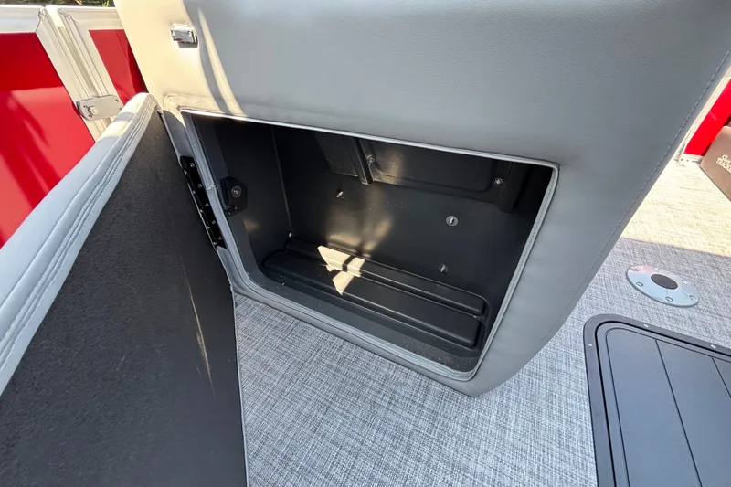 Slide: The Image of Open storage compartment on 2026 Sun Tracker Party Barge 22 XP3 pontoon boat. - 23