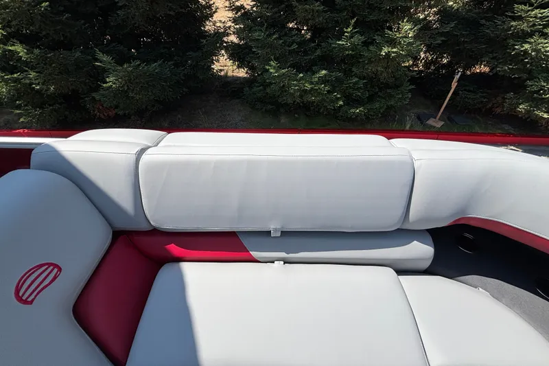 Slide: The Image of 2026 Sun Tracker Party Barge 22 XP3 interior seating with gray and red upholstery. - 26
