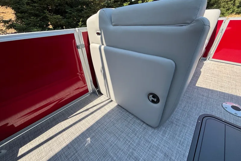 Slide: The Image of 2026 Sun Tracker Party Barge 22 XP3 interior with gray seating and red paneling. - 42