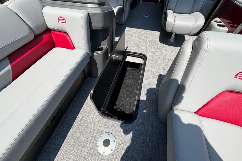 Slide: The Image of Interior of 2026 Sun Tracker Party Barge 22 XP3 with open storage compartment. - 30