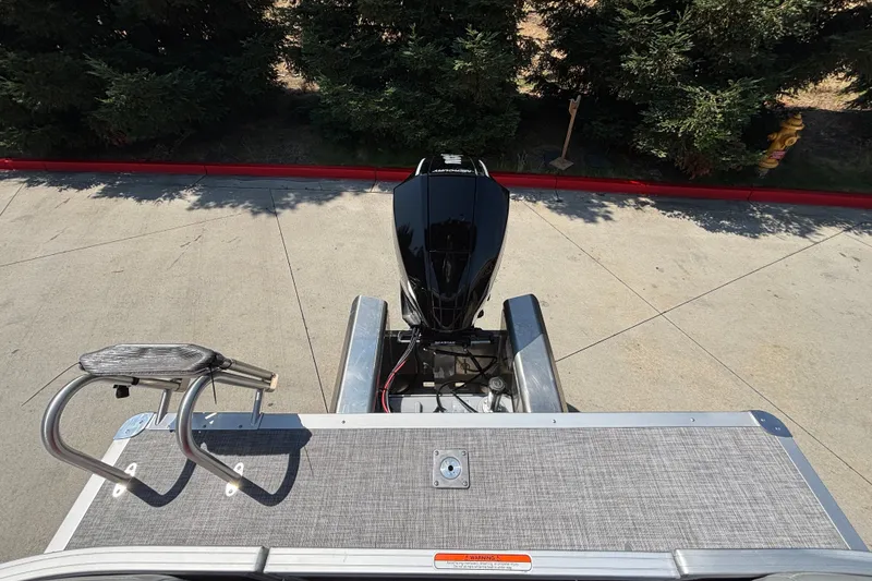 Slide: The Image of 2026 Sun Tracker Party Barge 22 XP3 pontoon boat with outboard motor and swim ladder. - 49