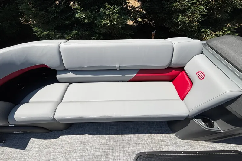 Slide: The Image of Luxurious seating on 2026 Sun Tracker Party Barge 22 XP3, featuring sleek gray and red upholstery. - 37