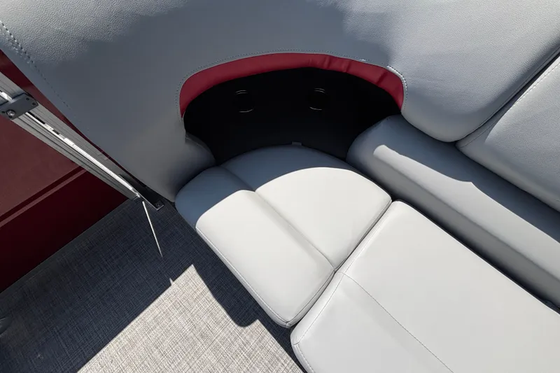 Slide: The Image of 2026 Sun Tracker Party Barge 22 XP3 interior seating with gray upholstery and red accents. - 32