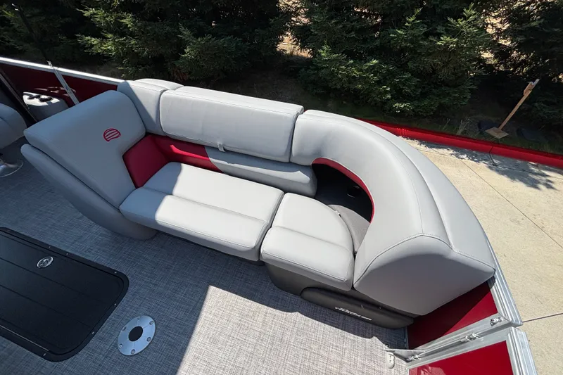 Slide: The Image of 2026 Sun Tracker Party Barge 22 XP3 with gray and red seating, outdoor setting. - 41