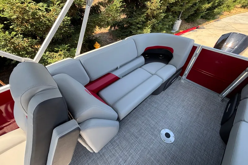 Slide: The Image of 2026 Sun Tracker Party Barge 22 XP3 interior with plush gray seating and modern design. - 39