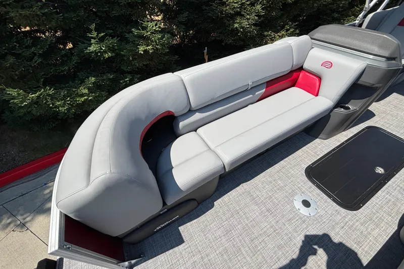 Slide: The Image of 2026 Sun Tracker Party Barge 22 XP3 with sleek gray seating and red accents. - 40