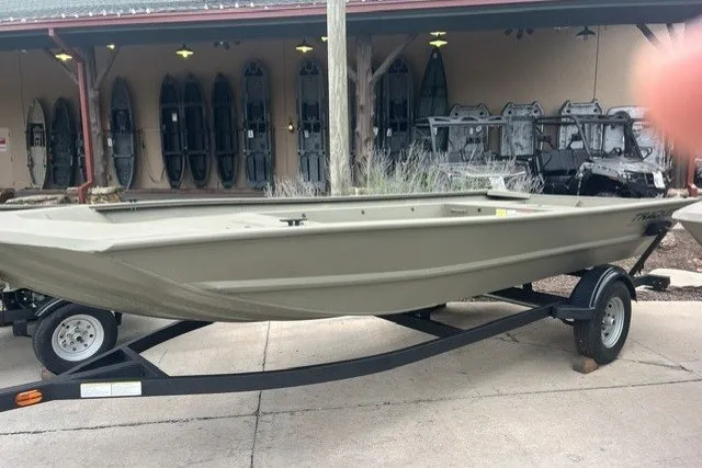 The Image of 2026 Tracker Grizzly 1754 Utility boat on trailer, displayed outdoors. - 0
