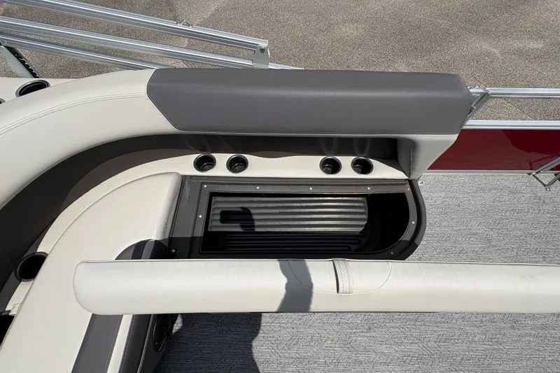 Slide: The Image of Close-up of a boat deck with gray and beige upholstery and a rounded railing. - 15