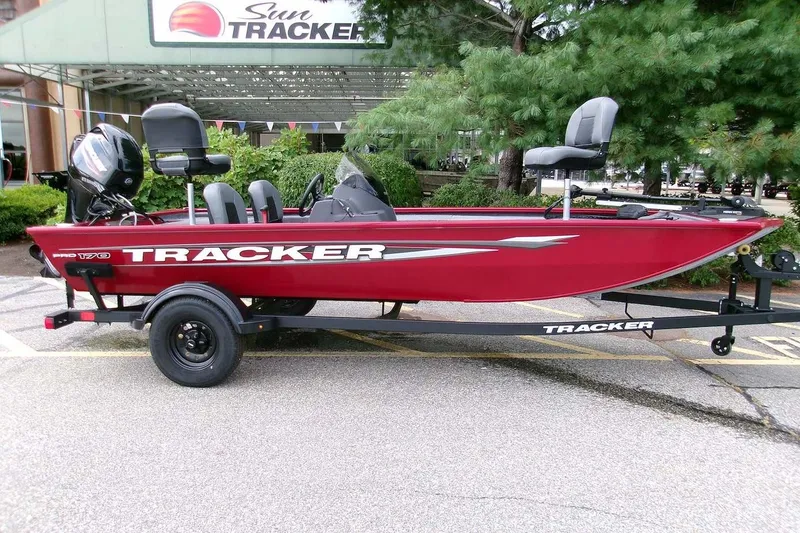 The Image of 2026 Tracker Pro 170 boat in red, parked on a trailer outdoors. - 0