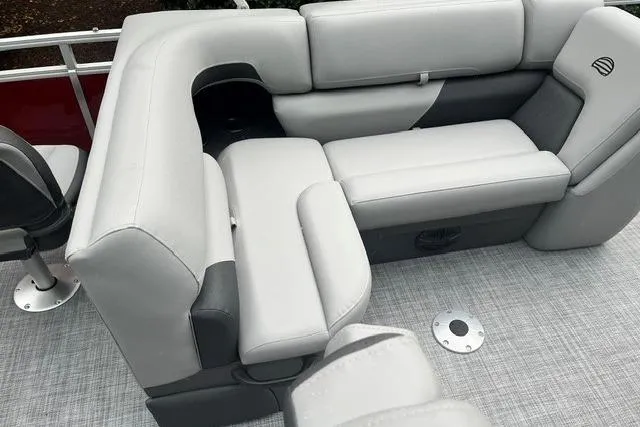 Slide: The Image of 2026 Sun Tracker SportFish 20 DLX pontoon boat with plush gray seating and modern design. - 9