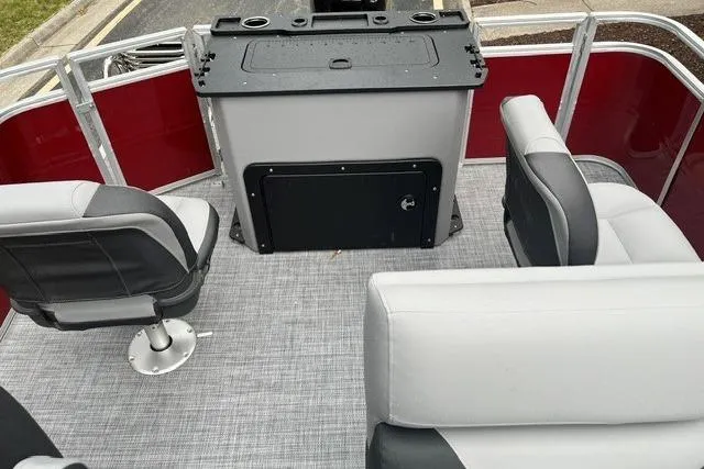 Slide: The Image of 2026 Sun Tracker SportFish 20 DLX interior with seating and control panel. - 6