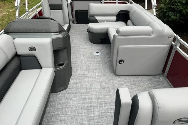 Slide: The Image of 2026 Sun Tracker SportFish 20 DLX pontoon boat interior with gray seating and flooring. - 4