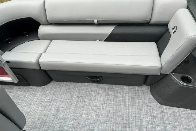 Slide: The Image of 2026 Sun Tracker SportFish 20 DLX boat interior with gray seating and flooring. - 10