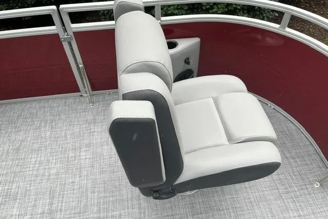 Slide: The Image of 2026 Sun Tracker SportFish 20 DLX boat seat with gray upholstery and cup holder. - 12