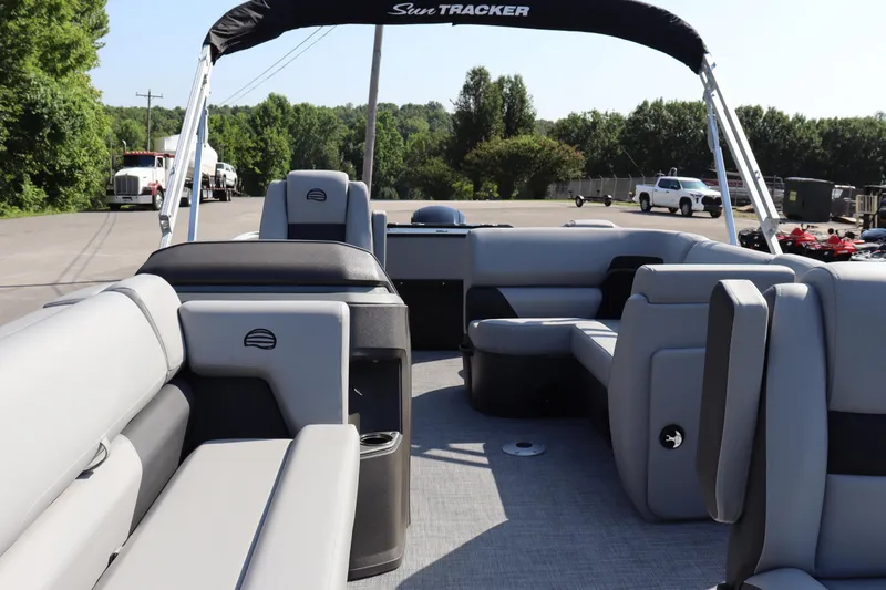 Slide: The Image of 2026 Sun Tracker SportFish 20 DLX pontoon boat with spacious seating and sleek design. - 6