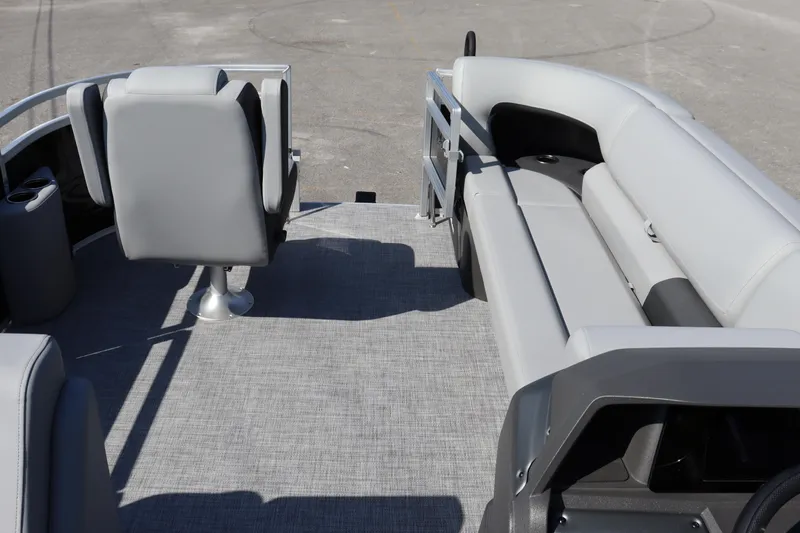 Slide: The Image of Interior of 2026 Sun Tracker SportFish 20 DLX pontoon boat with gray seating. - 13