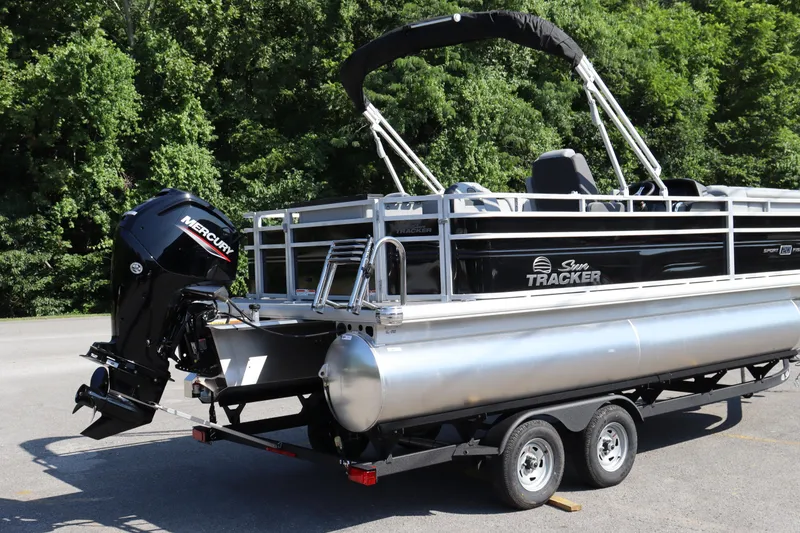 Slide: The Image of 2026 Sun Tracker SportFish 20 DLX pontoon boat with Mercury engine on trailer. - 18