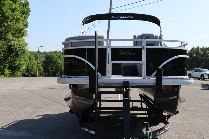 Slide: The Image of 2026 Sun Tracker SportFish 20 DLX pontoon boat on trailer in sunny outdoor setting. - 3