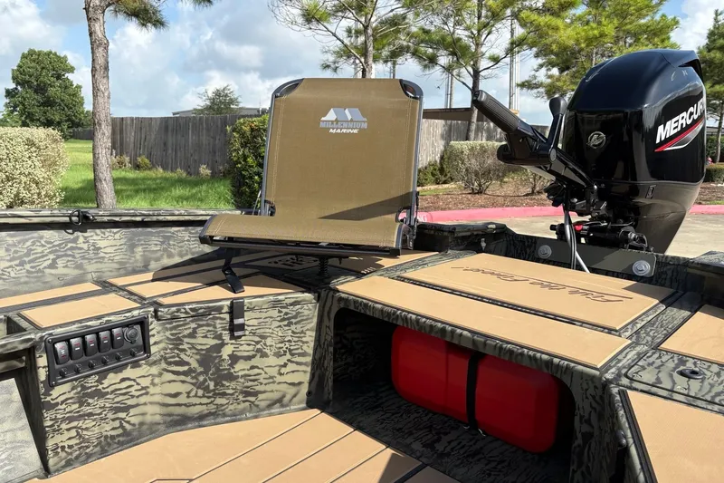 Slide: The Image of 2026 Tracker Grizzly 1756 T Marsh boat with Mercury engine and camo seating. - 4