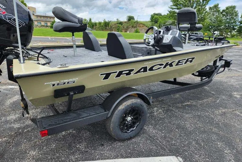 Slide: The Image of 2026 Tracker Pro Team 195 fishing boat on trailer in parking lot. - 3