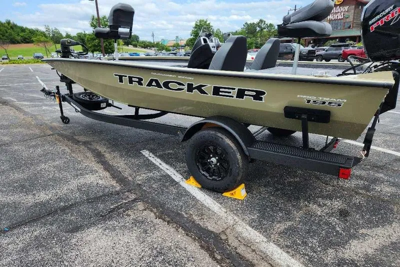 Slide: The Image of 2026 Tracker Pro Team 195 boat on trailer in parking lot. - 4