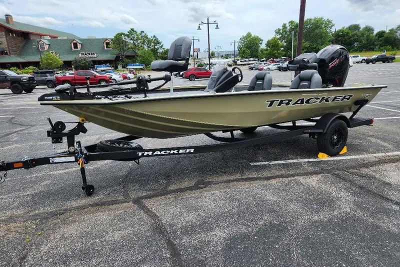 Slide: The Image of 2026 Tracker Pro Team 195 boat on trailer in parking lot, featuring sleek design and modern features. - 5
