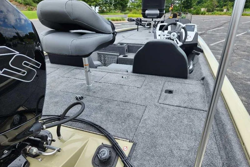 Slide: The Image of 2026 Tracker Pro Team 195 boat interior with seating and steering console. - 6