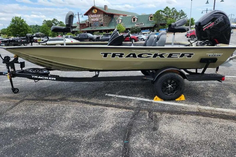 The Image of 2026 Tracker Pro Team 195 boat on trailer in parking lot. - 0