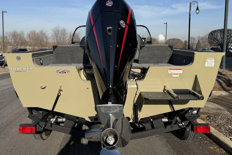 Slide: The Image of 2026 Tracker Targa V-19 Combo boat rear view with outboard motor and trailer. - 3