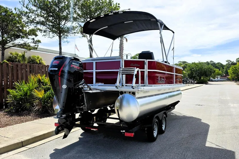 Slide: The Image of 2026 Sun Tracker Party Barge 20 DLX pontoon boat with Mercury engine on trailer. - 3