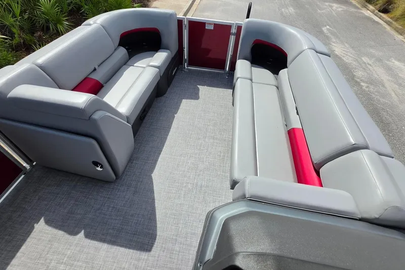 Slide: The Image of 2026 Sun Tracker Party Barge 20 DLX interior with gray and red seating. - 14