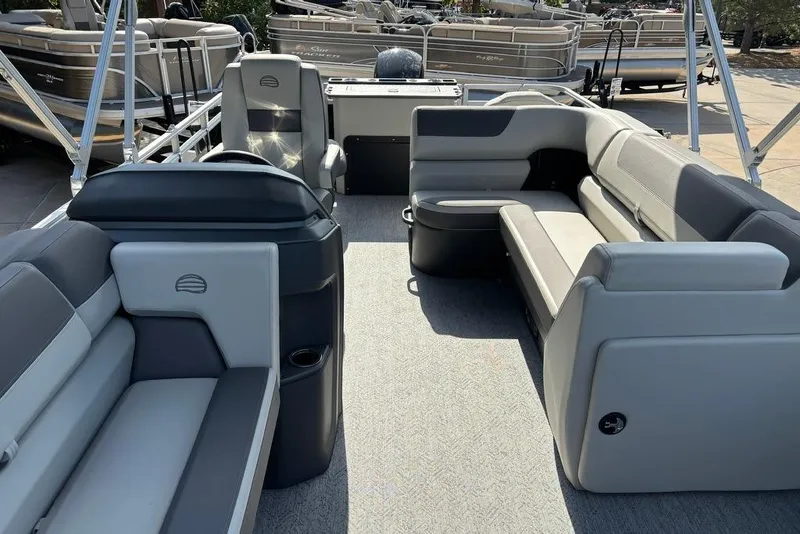 Slide: The Image of 2026 Sun Tracker Fishin' Barge 22 DLX interior with spacious seating and modern design. - 5