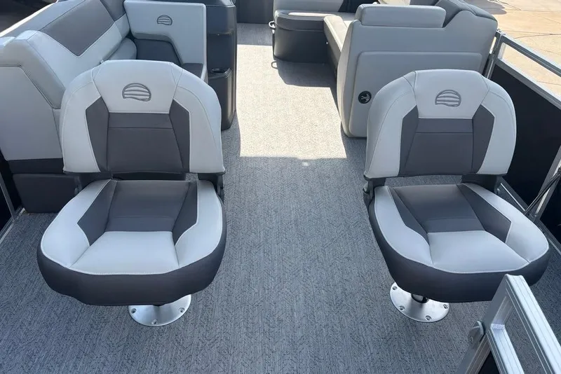 Slide: The Image of 2026 Sun Tracker Fishin' Barge 22 DLX interior with comfortable seating and modern design. - 4