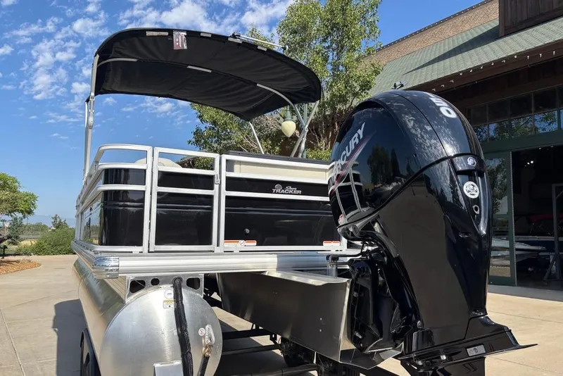 Slide: The Image of 2026 Sun Tracker Fishin' Barge 22 DLX pontoon boat with Mercury outboard motor. - 12