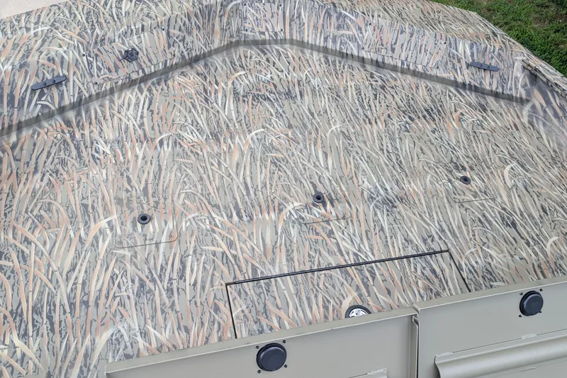 Slide: The Image of Camouflage-patterned deck of 2026 Tracker Grizzly 2072 CC boat. - 4