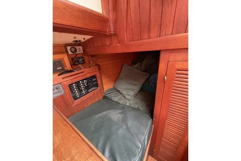 Slide: The Image of Cozy cabin interior of 1980 Ta Shing Baba 30 sailboat with wooden paneling. - 11