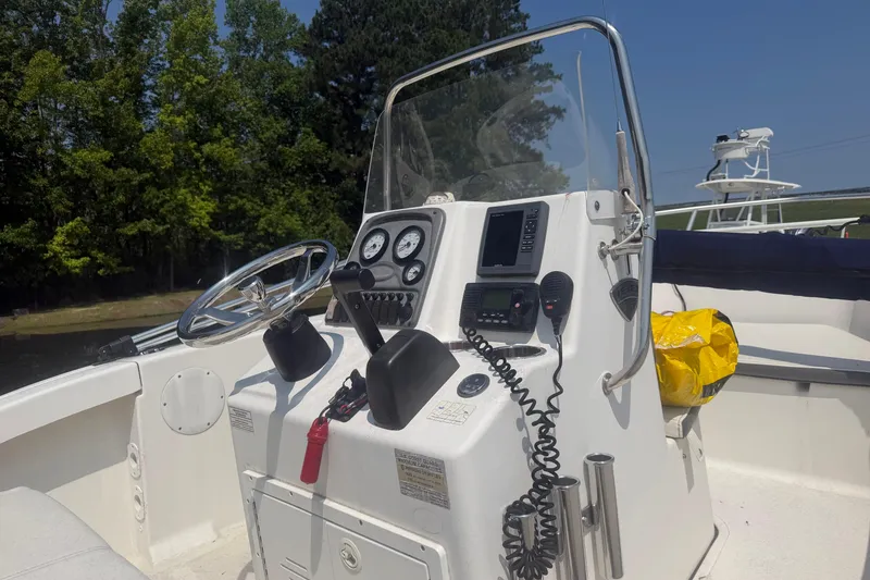 Slide: The Image of 2015 Tidewater 180 CC Adventure boat console with steering wheel and navigation equipment. - 5