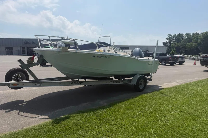 Slide: The Image of 2015 Tidewater 180 CC Adventure boat on trailer in parking lot. - 2