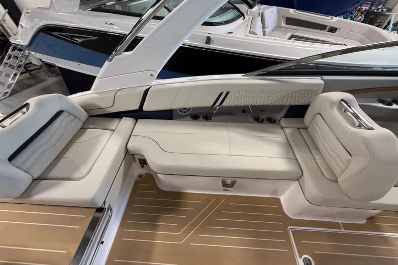 Slide: The Image of Luxurious seating on a 2027 Regal LS9 boat, featuring elegant white upholstery and sleek design. - 9
