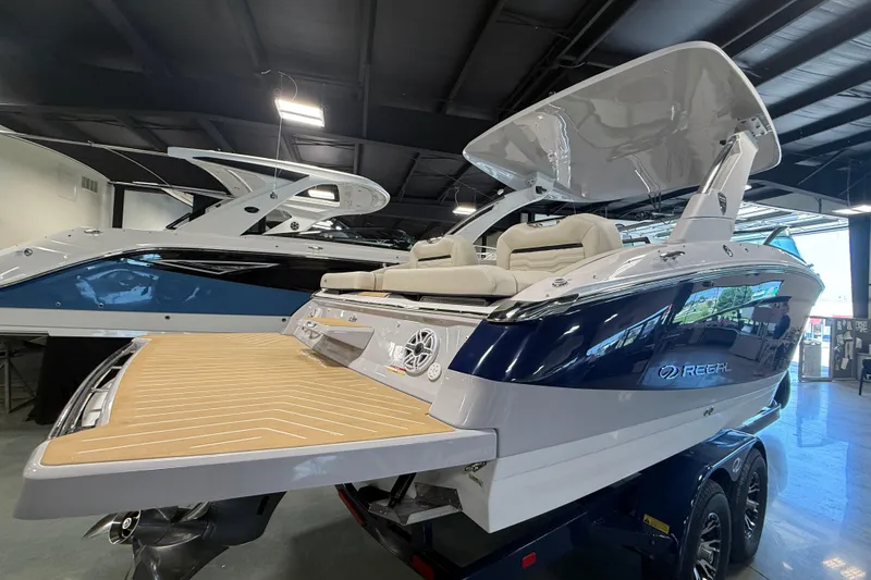Slide: The Image of 2027 Regal LS9 boat with sleek design and spacious deck in showroom. - 4
