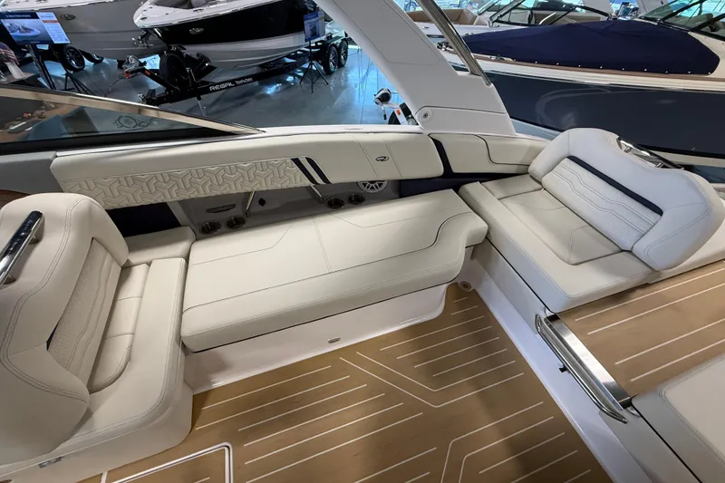 Slide: The Image of Luxurious interior of 2027 Regal LS9 boat with elegant white seating and wood flooring. - 10