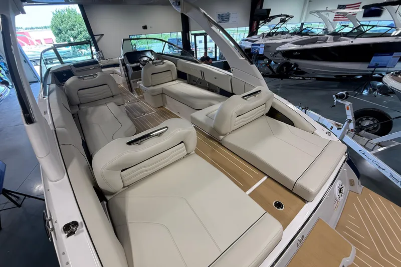 Slide: The Image of Luxurious 2027 Regal LS9 boat interior with plush seating and modern design in a showroom. - 6